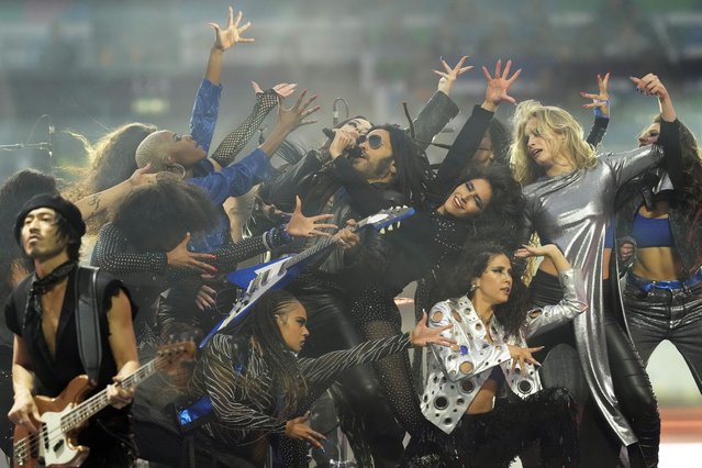 American singer-songwriter Lenny Kravitz, center, performs on the pitch before the Champions League final soccer match between Borussia Dortmund and Real Madrid at Wembley stadium in London, Saturday, June 1, 2024. (Photo by Frank Augstein/AP Photo)