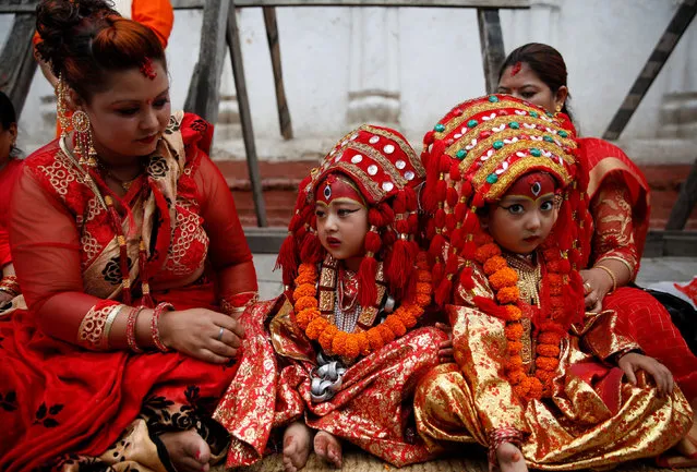Young girls dressed as the Living Goddess Kumari participate the Kumari Puja festival, in which young girls pose as the Living Goddess Kumari and are worshipped by people in belief that their children will remain healthy, in Kathmandu, Nepal on September 11, 2019. (Photo by Navesh Chitrakar/Reuters)
