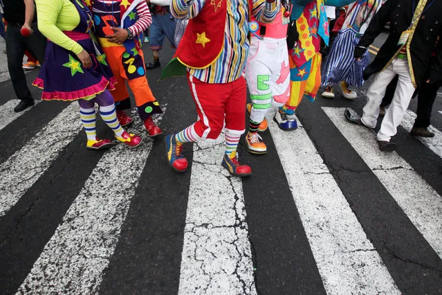 Clowns participate in a parade during the VIII Central America Clown Convention in San Salvador, El Salvador, May 18, 2016. (Photo by Jose Cabezas/Reuters)