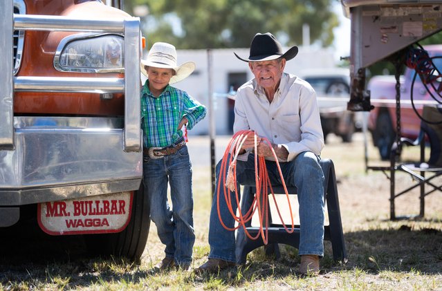 93 year-old Bob Holder, the world's oldest cowboy, stands for a portrait with 8 year-old competitor Asher McCulloch on the sidelines of the Mount Isa Rodeo on August 8, 2024 in Mount Isa, Australia. Established in 1959, the Mount Isa Rodeo is the richest in the southern hemisphere and attracts contestants from all parts of the world. (Photo by Dan Peled/Getty Images)