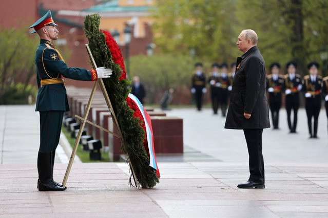 Russian President Vladimir Putin attends a wreath-laying ceremony at the Tomb of the Unknown Soldier after the military parade marking the 77th anniversary of the end of World War II in Moscow, Russia, Monday, May 9, 2022. (Photo by Anton Novoderezhkin, Sputnik, Kremlin Pool Photo via AP Photo)