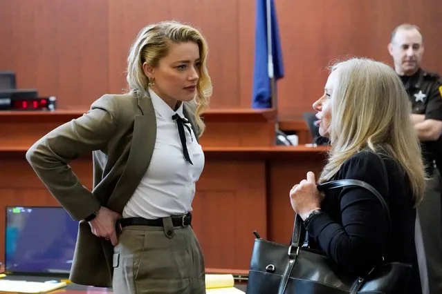 Actor Amber Heard arrives into the courtroom after a break during the Depp v Heard defemation lawsuit at the Fairfax County Circuit Courthouse in Fairfax, Virginia, USA, 23 May 2022. Johnny Depp's 50 million US dollar defamation lawsuit against Amber Heard started on 10 April. (Photo by Steve Helber/EPA/EFE/Pool)
