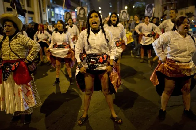 In this Friday, July 7, 2017 photo, protesters representing forcibly sterilized women by the government during the presidency of Alberto Fujimori, perform during a march in Lima, Peru. Peruvian President Pedro Kuczynski said on Friday that a group of doctors will help him determine whether or not to release ex-president Alberto Fujimori, sentenced to 25 years prison, with a “medical pardon”. (Photo by Rodrigo Abd/AP Photo)