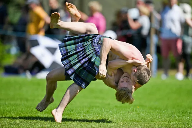 Wrestlers compete at Inveraray Highland Games on July 18, 2017 in Inverarary, Scotland. The Games celebrate Scottish culture and heritage with field and track events, piping, highland dancing competitions and heavy events including the world championships for tossing the caber.   (Photo by Jeff J. Mitchell/Getty Images)