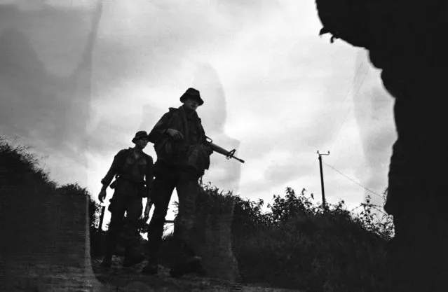Two members of a hunter-killer team move out from their day base near the Ong Que Rubber Plantation to set up a night ambush for the enemy, September 23, 1969.  The GIs are members of Charlie Company, 2nd Battalion, 199th Infantry Brigade, based at Xuan Loc, 45 miles northeast of Saigon. (Photo by AP Photo)