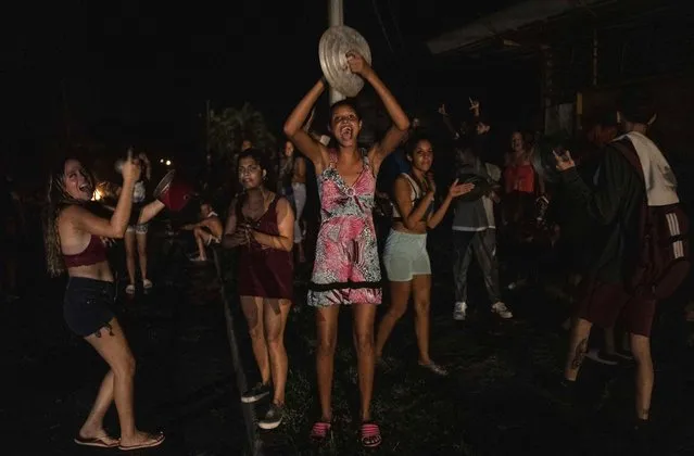 People protest asking for the restoration of electrical service after four days of blackout due to the devastation of Hurricane Ian in Bacuranao, Cuba, Friday, September 30, 2022. (Photo by Ramon Espinosa/AP Photo)