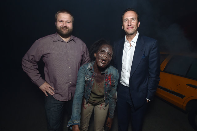 Executive producer Robert Kirkman, left, and Charlie Collier, president/general manager of AMC, attend the season five premiere of “The Walking Dead” at AMC Universal Citywalk on Thursday, October 2, 2014, in Universal City, Calif. (Photo by John Shearer/Invision for AMC/AP Images)