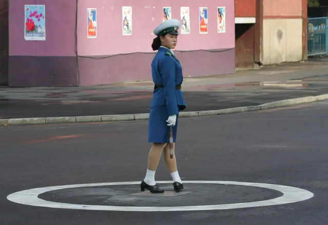 A North Korean traffic policewoman works in central Pyongyang October 15, 2005. (Photo by Reinhard Krause/Reuters)