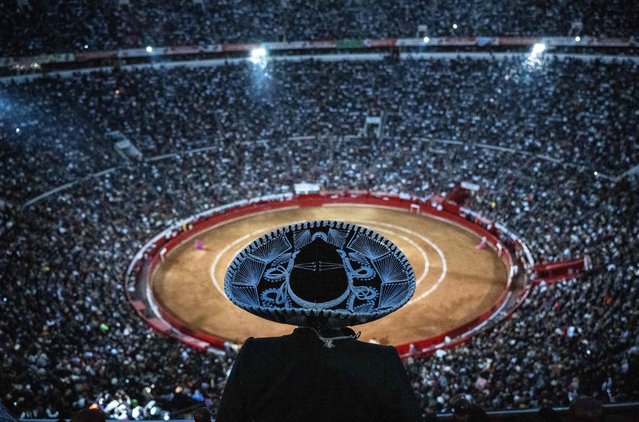 A man wearing a traditional mariachi hat watches a bullfight at the Monumental Plaza de Toros Mexico in Mexico City on January 28, 2024. Bullfighting resumed on Sunday in Mexico City after the Supreme Court revoked an earlier suspension. (Photo by Carl de Souza/AFP Photo)