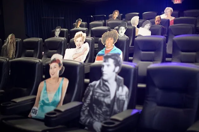 Seats are spaced by cardboard cutouts of movie characters aimed at social distancing ahead of the reopening of the Arena Cinelounge theatre in Los Angeles, California, June 17, 2020. (Photo by Mario Anzuoni/Reuters)
