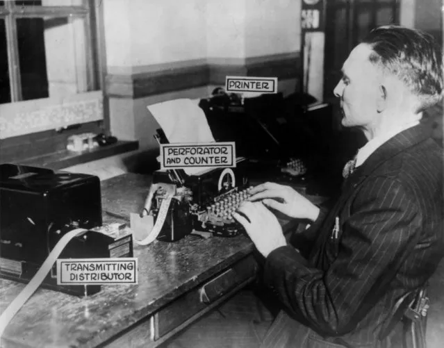 The teletypesetter is a machine that will set type by radio or telegraph, invented by Walter W. Morey of East Orange, N.J.  The project was backed by Frnk E. Gannett, newspaper publisher. Here, an unidentified operator at types at the master keyboard, which punches dots representing each character, December 6, 1928. (Photo by AP Photo)