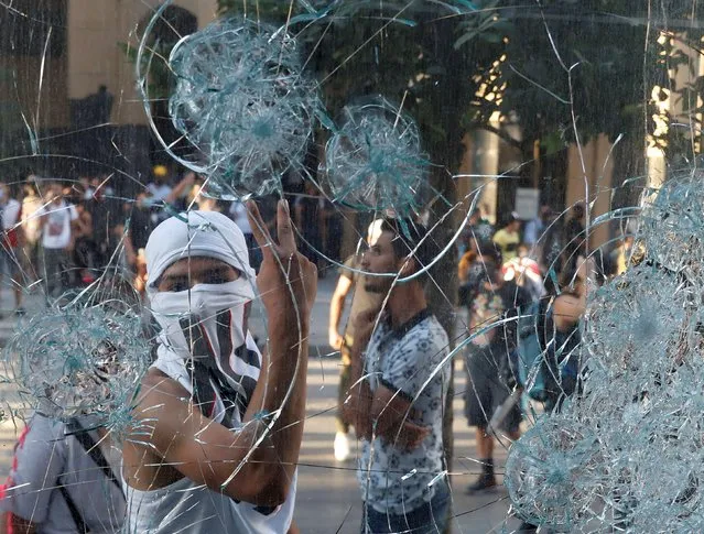 A demonstrator gestures during a protest following Tuesday's blast in Beirut's port area, in Beirut, Lebanon, August 9, 2020. (Photo by Goran Tomasevic/Reuters)