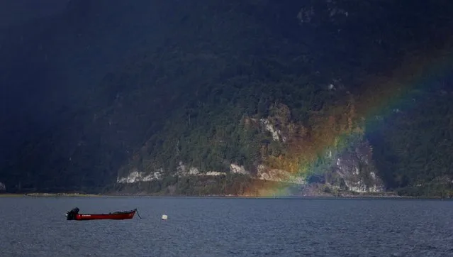A rainbow is seen on the Reloncavi Estuary at Cochamo town in the area of the Calbuco volcano, May 1, 2015. (Photo by Ivan Alvarado/Reuters)