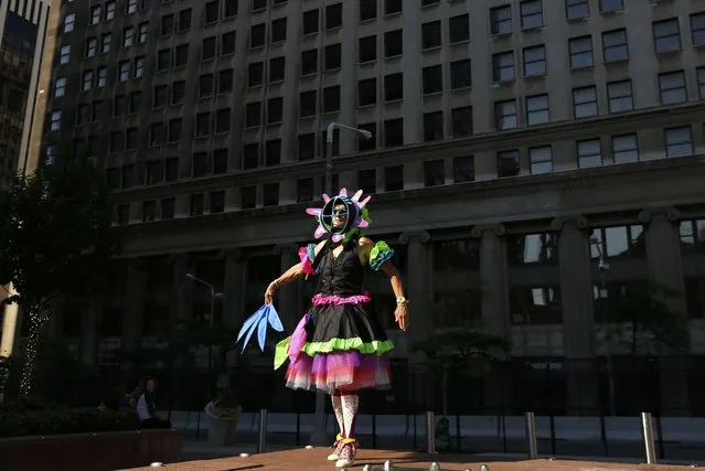 An artist not affiliated with any group dances near the Republican National Convention in Cleveland, Ohio, U.S. July 18, 2016. (Photo by Lucas Jackson/Reuters)