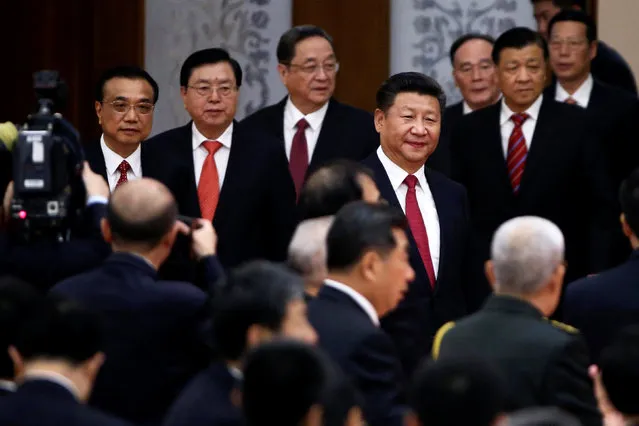 China's President Xi Jinping (C), Premier Li Keqiang (L) and other leaders arrive for the reception to celebrate National Day at the Great Hall of the People in Beijing, China September 30, 2016. (Photo by Damir Sagolj/Reuters)