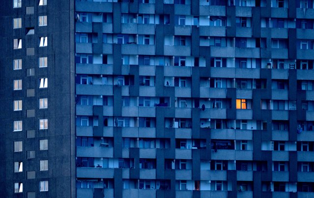 A light burns in the window of an apartment house in Frankfurt, Germany, early Monday, April 29, 2024. (Photo by Michael Probst/AP Photo)