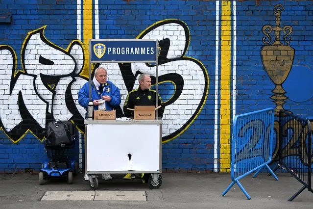 Match day programmes are sold outside the stadium prior to the Premier League match between Leeds United and Manchester United at Elland Road on February 12, 2023 in Leeds, England. (Photo by Gareth Copley/Getty Images)