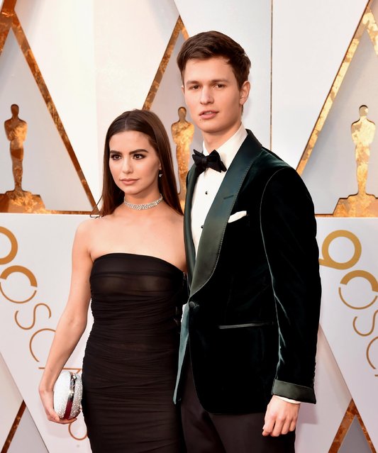 Ansel Elgort (R) and Violetta Komyshan attend the 90th Annual Academy Awards at Hollywood & Highland Center on March 4, 2018 in Hollywood, California. (Photo by Kevin Mazur/WireImage)