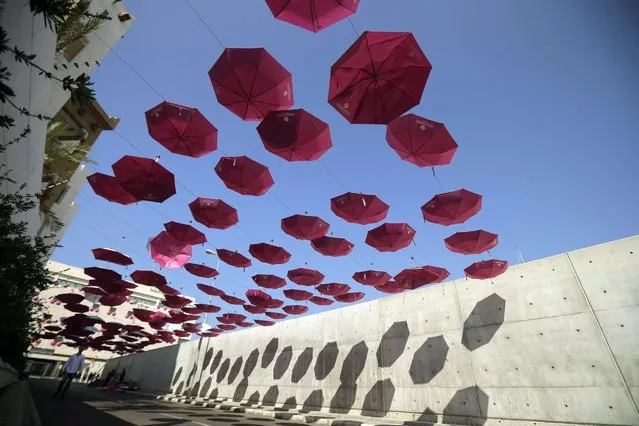 Pink umbrellas decorate the Lebanese Ministry of Public Health in the capital Beirut, October 7, 2016, as part of a national campaign for the public awareness of breast cancer. (Photo by Joseph Eid/AFP Photo)