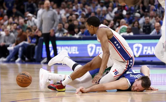 DeAnthony Melton #8 of the Philadelphia 76ers collides with Luka Doncic #77 of the Dallas Mavericks while battling for a loose ball in the second half at American Airlines Center on March 2, 2023 in Dallas, Texas. The Mavericks won 133-126. (Photo by Ron Jenkins/Getty Images)