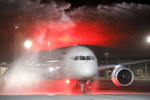 An Air India Boeing 787-8 Dreamliner plane receives a water cannon salute upon its landing at Ben Gurion International Airport in Lod, near Tel Aviv, Israel, March 22, 2018. (Photo by Amir Cohen/Reuters)