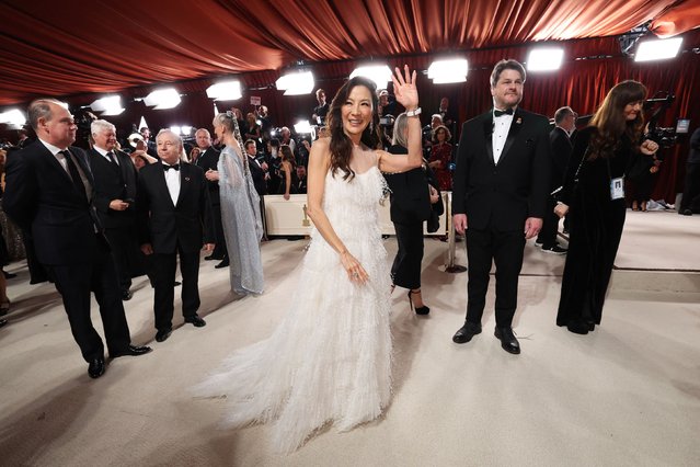 Swiss-based Malaysian Chinese actress Michelle Yeoh pose on the champagne-colored red carpet during the Oscars arrivals at the 95th Academy Awards in Hollywood, Los Angeles, California, U.S., March 12, 2023. (Photo by Mario Anzuoni/Reuters)
