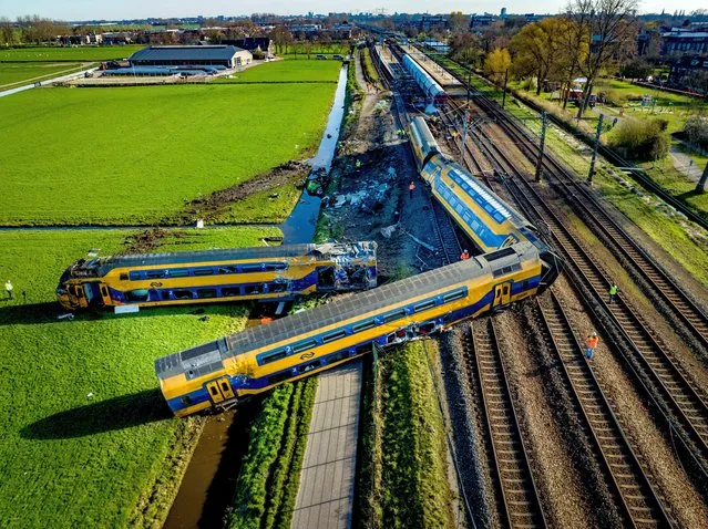 A view of the site in Voorschoten, Netherlands on April 5, 2023, where a passenger train derailed. At least one person died and several others were seriously injured after a passenger train and a freight train collided with construction equipment on the tracks. (Photo by Robin Utrecht/Rex Features/Shutterstock)