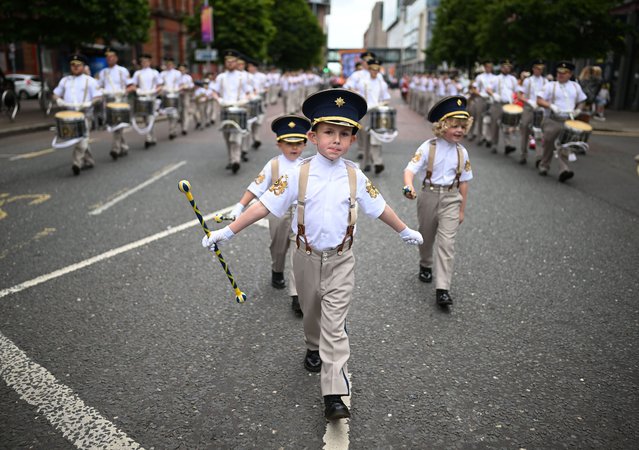 Orangemen and band members take part in the annual Twelfth of July parade on July 12, 2024 in Belfast, United Kingdom. The Twelfth of July, also known as “The Twelfth” or “Orangemen's Day”, is celebrated in Northern Ireland to commemorate King William's victory over Catholic King James II at the Battle of the Boyne 334 years ago. The day features parades, bonfires, wreath-laying ceremonies, and performances. The Belfast parade attracts tens of thousands of spectators each year and is part of broader celebrations with demonstrations hosted in 18 locations across Northern Ireland, including Bangor, Ballymena, Carrickfergus, Newtownards, and Derry. (Photo by Charles McQuillan/Getty Images)