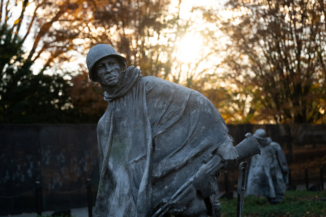Sun shines through the Korean War Veterans Memorial on Veterans Day in Washington on November 11, 2025. (Photo by Annabelle Gordon/Reuters)