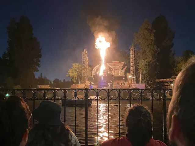 This photo courtesy of Shawna Bell shows a fire during the “Fantasmic” show in the Tom Sawyer Island section of the Disneyland complex in Anaheim, California on Saturday, April 22, 2023. (Photo by Shawna Bell vía AP Photo)