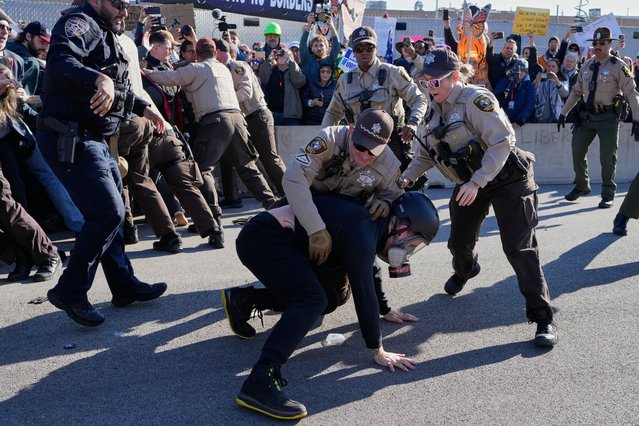 Cook County Sheriff Police detain a protester outside an ICE processing facility in the Chicago suburb of Broadview, Ill., Friday, November 14, 2025. (Photo by Nam Y. Huh/AP Photo)