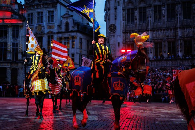Performers in medieval costumes take part in the procession of 'Ommegang' at the Grand Place in Brussels, Belgium, 03 July 2024. Ommegang is Brussels' traditional pageant to mark the Joyous Entry of Holy Roman Emperor Charles V. It depicts the historical re-enactment of the gala fete on 02 June 1549, organised by the Magistrate of Brussels, and given in honour of the Emperor Charles V “Quint”, his son Philip, Infant of Spain and Duke of Brabant, and his sisters, Maria, Queen of Hungary and Eleanore, Queen Dowager of France (widow of Francis I). (Photo by Olivier Matthys/EPA/EFE)