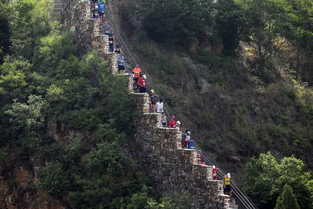Participants run the Great Wall Marathon at the Huangyaguan section of the Great Wall of China, in Jixian of Tianjin, China May 19, 2018. (Photo by Jason Lee/Reuters)