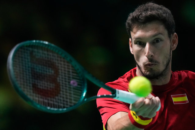 Spain's Pablo Carreno Busta returns a ball to Italy's Matteo Berrettini during a Davis Cup final singles tennis match between Italy and Spain, in Bologna, Italy, Sunday, November 23, 2025. (Photo by Luca Bruno/AP Photo)