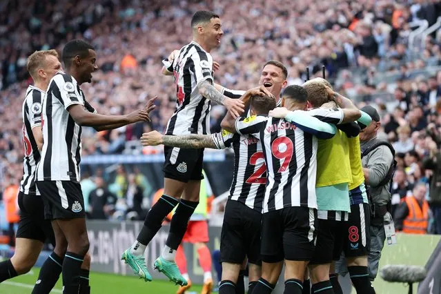 Players of Newcastle United celebrate their side's first goal, an own goal by Deniz Undav of Brighton & Hove Albion (not pictured), during the Premier League match between Newcastle United and Brighton & Hove Albion at St. James Park on May 18, 2023 in Newcastle upon Tyne, England. (Photo by Alex Livesey/Getty Images)