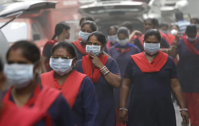 A group of Indian women wear pollution masks arrive to a protest against air pollution in New Delhi, India, Sunday, November 6, 2016. Even for a city considered one of the worlds dirtiest, the Indian capital hit a new low this week. Air so dirty you can taste and smell it; a gray haze that makes a gentle stroll a serious health hazard. According to one advocacy group, government data shows that the smog that enveloped the city midweek was the worst in the last 17 years. The concentration of PM2.5, tiny particulate pollution that can clog lungs, averaged 12 times the government norm and a whopping 70 times the WHO standards. (Photo by Manish Swarup/AP Photo)