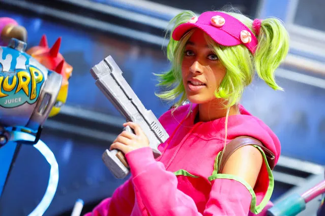 An attendee dresses as a character from the game Fortnite at E3, the world's largest video game industry convention in Los Angeles, California on June 12, 2018. (Photo by Mike Blake/Reuters)