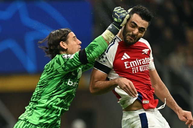 Inter Milan's Swiss goalkeeper #01 Yann Sommer makes a save in front of Arsenal's Spanish midfielder #23 Mikel Merino during the UEFA Champions League football match between Inter Milan and Arsenal at the San Siro stadium in Milan on November 6, 2024. (Photo by Gabriel Bouys/AFP Photo)
