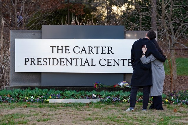 Visitors look on outside The Carter Presidential Center following the death of Jimmy Carter in Atlanta, Georgia on December 29, 2024. The 39th president of the United States died today in his hometown of Plains, Georgia. He was 100. (Photo by USA Today)
