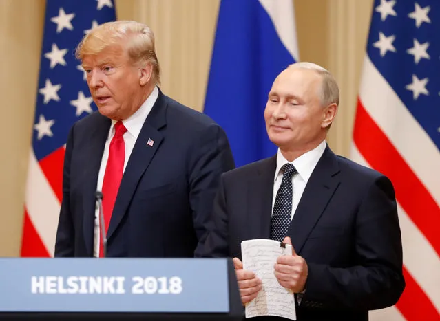 U.S. President Trump and Russian President Putin arrive for a joint news conference in Helsinki, Finland July 16, 2018. (Photo by Grigory Dukor/Reuters)