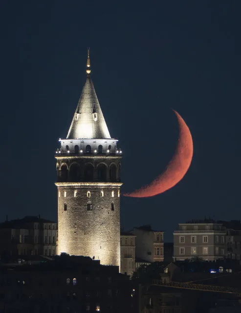 Crescent Moon rises behind Galata Tower in Istanbul, Turkiye on June 22, 2022. (Photo by Isa Terli/Anadolu Agency via Getty Images)