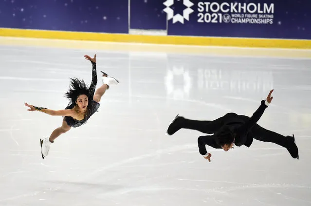 Wenjing Sui and Cong Han of China perform during a practice session of the pairs at the Figure Skating World Championships in Stockholm, Sweden, Tuesday, March 23, 2021. (Photo by Martin Meissner/AP Photo)