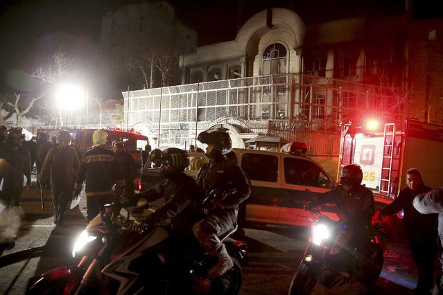 Iranian security protect Saudi Arabia's embassy in Tehran, Iran, while a group of demonstrators gathered to protest execution of a Shiite cleric in Saudi Arabia, Sunday, January 3, 2016. (Photo by Ebrahim Noroozi/AP Photo)