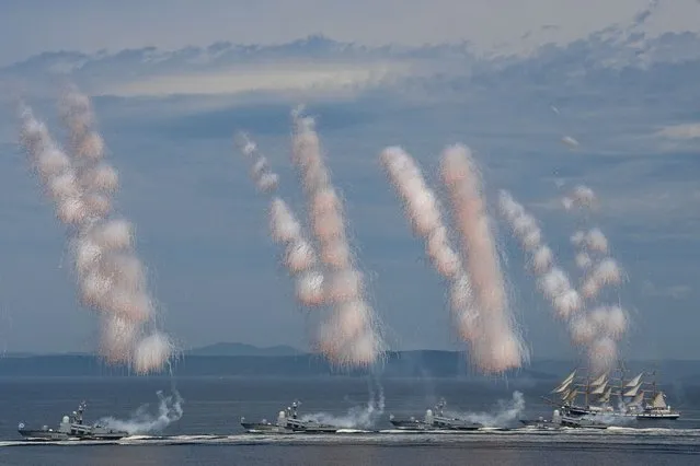 Russia's Pacific Fleet warships parade off the port city of Vladivostok during the Navy Day celebrations on July 30, 2023. (Photo by Pavel Korolyov/AFP Photo)