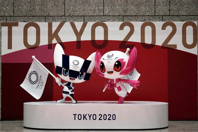 The statues of Miraitowa, left, and Someity, right, the official mascots for the Tokyo 2020 Olympics and Paralympics, are seen at an unveiling event marking 100 days before the start of the Olympic Games, at the Tokyo Metropolitan Government building, in Tokyo, Japan, April 14, 2021. (Photo by Eugene Hoshiko/Pool via Reuters)