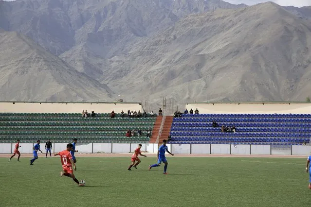 Players participate in “climate cup” a first of its kind “climate-friendly” soccer tournament on the outskirts of Leh, Ladakh, India, Tuesday, September 5, 2023. The organizers say the matches are first in Asia to be held at an altitude of 11,000 feet, about 3,350 meters, and with a minimum carbon footprint. Ladakh is an ecologically fragile territory where oxygen is thin, and breathing is hard. (Photo by Stanzin Khakyab/AP Photo)