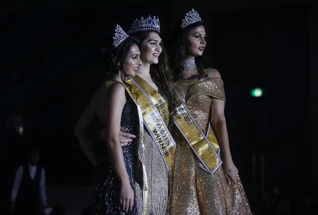 Winner of Miss Transqueen India 2018 beauty pageant Vina Sendre (C) first runner up Sanya Sood (L) and second runner up Nimitha Ammu pose for photographs in Mumbai, India on October 7, 2018. (Photo by Francis Mascarenhas/Reuters)