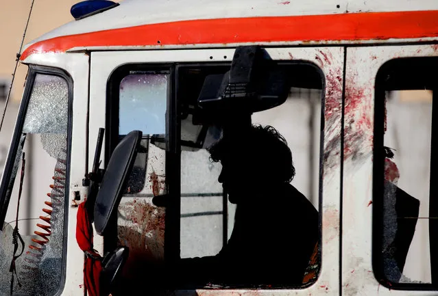 An official shifts a police vehicle from the scene of a suicide bomb blast near the police administration building, in Kabul, Afghanistan, 01 February 2016. At least 10 people were killed when an alleged Taliban suicide bomber blew himself up outside a police administration building in Kabul on 01 February. A further 20 people were injured, Deputy Interior Minister, General Mohammad Ayub Salangi, said on Twitter. The Taliban have claimed responsibility online. (Photo by Hedayatullah Amid/EPA)
