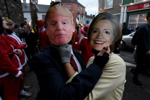 People costumed as Donald Trump and Hillary Clinton are seen during an Irish tradition of Hunting of the Wren festival held every St. Stephen's Day in Dingle, Ireland December 26, 2016. (Photo by Clodagh Kilcoyne/Reuters)