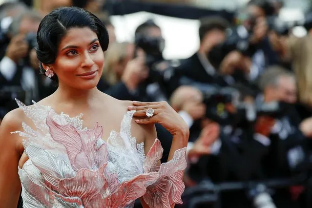 A guest arrives for the screening of the film “France” at the 74th edition of the Cannes Film Festival in Cannes, southern France, on July 15, 2021 . (Photo by Sarah Meyssonnier/Reuters)